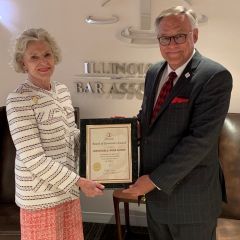 Illinois Supreme Court Chief Justice Anne Burke and ISBA President Dennis Orsey