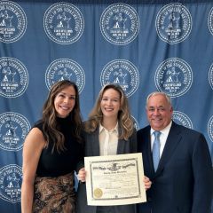 ISBA President-Elect Perry Browder and his wife, Michelle, celebrate with their daughter, Emily, after she received her law license. 11
