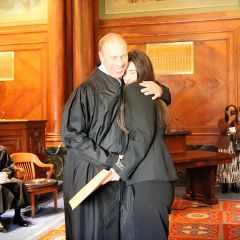 Hon. John Lowry congratulates his daughter, Kathleen Lowry