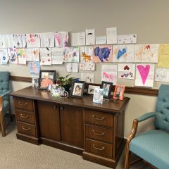 Terry Black: "I assume most peoples' prized possessions will consist of famous persons, awards, special books, or pieces or souvenirs from life or travel. I have all of those things in my office, too, but I elected to enter a picture of my "Granddaughters Wall." My granddaughters are now 11, 7, and 5 years old, but many of these pictures were drawn when they were a little younger. They all live hours away, so getting these pictures is a great pleasure to me. Self-addressed, pre-stamped envelopes I send them probably assist in this procedure."