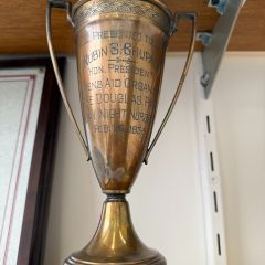 Joel Chupack: "For years I was mystified by what was 'The Men's Aid Organization of the Douglas Park Day Night Nursery' and why was my grandfather, Ruben S. Chupack, was given a trophy for 'Hon. President' in 1936. A few years earlier he emigrated from Latvia. This oddly named organization was a first of its kind. It was an orphanage and a day care center. It was formed in response to the Spanish Flu epidemic of 1918. So many parents died in this epidemic that children were on the street, literally. The nursery provided day care for the surviving parent that worked, and an orphanage for children who lost both parents. The trophy reminds me that while Ruby, as we called him, came for the American Dream. He knew that dream can only has meaning if you give of yourself to others less fortunate."