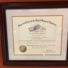 Bridget Hutchen: "I have two related favorite items in my office. The first is my U.S. Supreme Court Admission Certificate from 2018 and the second is my Ruth Bader Ginsburg bobblehead! The admission to the U.S. Supreme Court is purely an honorarium with no practical impact on my practice, but it was a beautiful event sponsored by Loyola Law School. Justice Ginsburg was still alive and was sitting on the bench that day. I have always admired her, both personally and professionally. Much of her personal life mirrored my own personal experiences -- a wife, a mother, following her husband's career and transferring to a different city and law school. During Covid when we appeared via Zoom, I would position her bobbleheaad so that it was visible in the Zoom hearing!