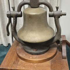 E. Phillips Knox: "Steam engine bell from the Illinois Central Railroad. A gift to my grandfather, Enos Phillips, Urbana attorney from 1925-1978, from the President of the Illinois Central Railroad. Cast in 1900, it is alleged to have been removed from the last steam locomotive retired from service by the ICR."
