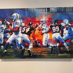 Heather Kroencke: "I love seeing this signed Peyton Manning painting on my office wall and remembering the Colts’ 2007 Superbowl win against the Bears! Back in 2014, I got into a heated bidding war at a charity function against an avid Bears fan for this painting. I ultimately won, but when my husband (also an avid Bears fan) realized what I was bringing home, he was depressed at having to relive this memory. Turns out, the man who had donated this item overheard his bemoaning and told us he could also get Brian Urlacher’s signature to ease the blow. And he did!"