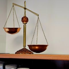 Sandra Mertens: "Attached is a photo of the scales of justice that were given to me many years ago as a law school graduation gift. The scales are a constant reminder that the legal system was designed to be fair and balanced. I keep the scales off-kilter to encourage myself to be such a good advocate that I "tip scales" in my client's favor."