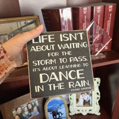 Genevieve Miller: "One of my most treasured possessions in my office is a sign that reads, 'Life isn't about waiting for the storm to pass, it's about learning to dance in the rain.' It's more than decor -- it's a daily reminder of resilience and finding joy in life's most difficult moments. Whether facing professional stress or personal trials, the sign grounds me with its quiet wisdom. It reminds me that growth often comes not from avoiding discomfort, but from learning how to move through it -- with grace, courage, and rhythm. A thoughtful secretary gifted it to me during a challenging time in my early career."