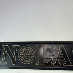 Kirsten Stevens: "My beautiful piece of art adorns the wall just above left of my computer monitor. I’m fortunate to be a snowbird after 32 years of practice and get to glance at this gem throughout the day in my Mandeville, LA home near Lake Pontchartrain. While serving clients and attending Zoom court, I look up to plan my next adventure in the 307-year-old city I love!"