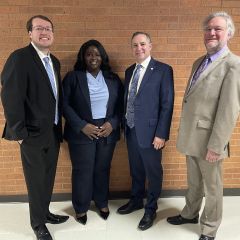 New lawyers with Illinois Supreme Court Justice David K. Overstreet and ISBA Board of Governors Member Tom Speedie (far right) 10
