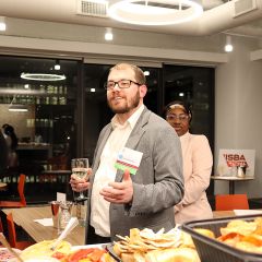 YLD Chair Jason Blumenthal welcomes attendees to the Wine Tasting event.