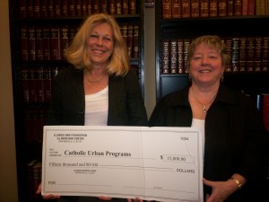 IBF Grants Committee Member Ann Hatch of Belleville presents a $15,000 grant to Kathleen O’Keefe, attorney for the Neighborhood Law Office. 