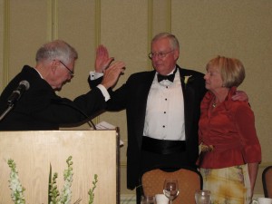 President O'Brien is sworn in by Illinois Supreme Court Chief Justice Thomas Fitzgerald as his wife Karen looks on.