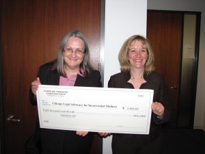 IBF Grants Committee Member Lori Levin of Chicago presents an $8,000 grant to Gail Smith, CLAIM's Executive Director.