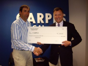 IBF Board member and ISBA 2nd Vice President John Locallo of Chicago presents a $25,000 check to Al Schwartz, CARPLS Executive Director. 