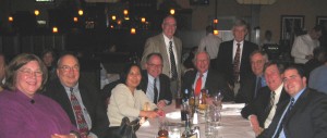 ISBA 3rd Vice President John Thies (standing, center) and ISBA President John O'Brien (seated, center) meet with the Champaign County Bar Association Board of Governors on Tuesday night.